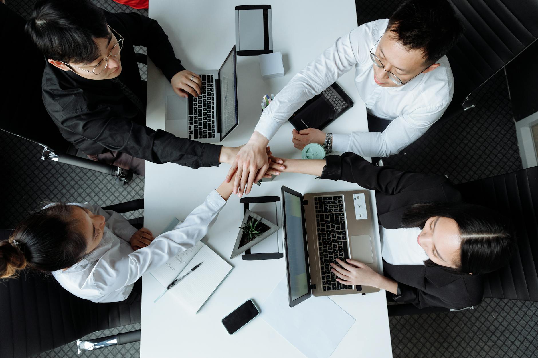 Operations team collaborating around a shared compliance dashboard